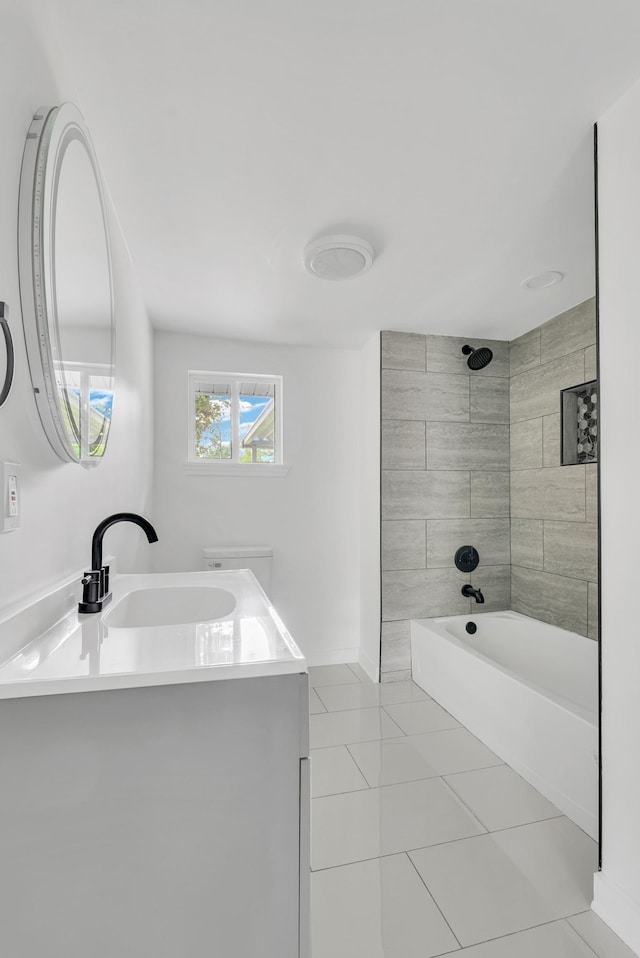 bathroom with bathing tub / shower combination, tile patterned flooring, and vanity