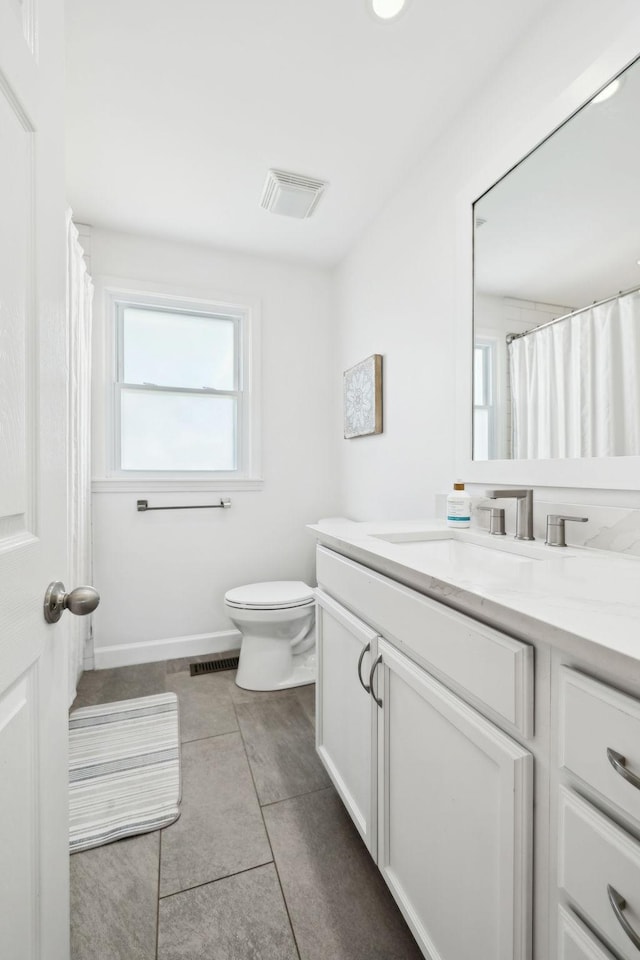 1048 Edgewater Cir, Gallatin, TN 37066 - full bathroom with toilet, tile patterned flooring, visible vents, and vanity