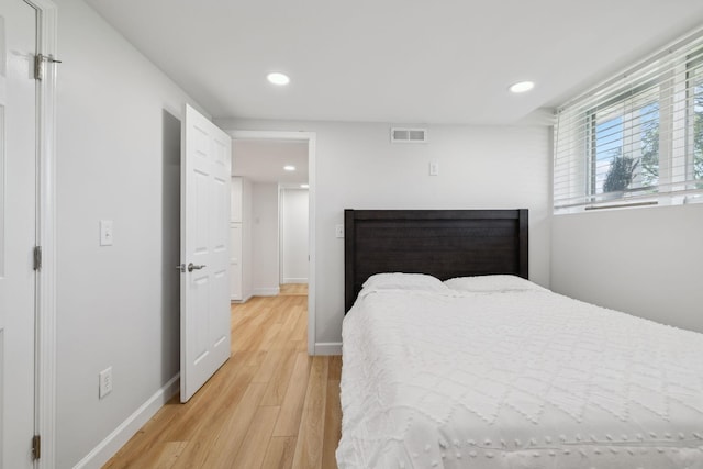 1048 Edgewater Cir, Gallatin, TN 37066 - bedroom with baseboards, visible vents, light wood finished floors, and recessed lighting