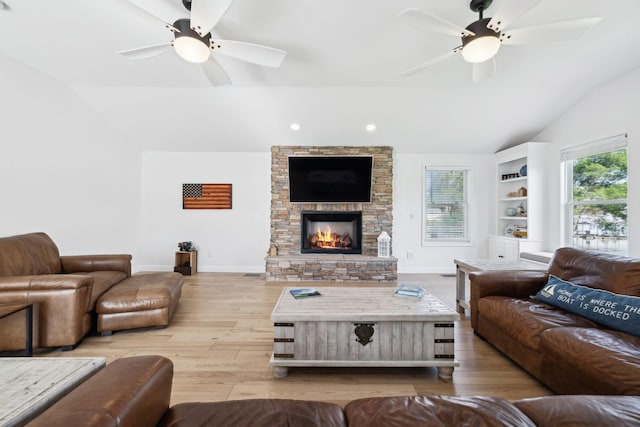1048 Edgewater Cir, Gallatin, TN 37066 - living area with baseboards, vaulted ceiling, a fireplace, wood finished floors, and a ceiling fan
