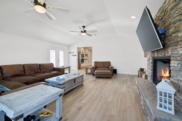 1048 Edgewater Cir, Gallatin, TN 37066 - living area with a large fireplace, vaulted ceiling, light wood finished floors, baseboards, and a ceiling fan