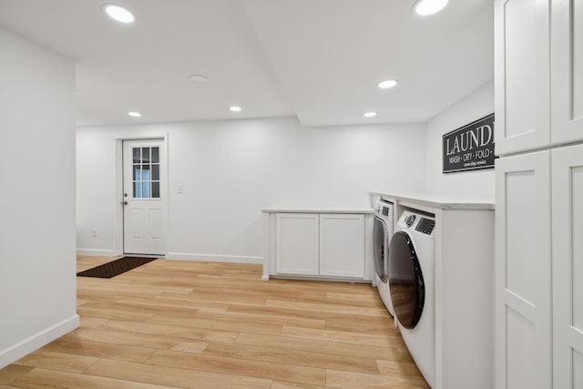 1048 Edgewater Cir, Gallatin, TN 37066 - washroom with recessed lighting, cabinet space, washing machine and dryer, light wood-style flooring, and baseboards