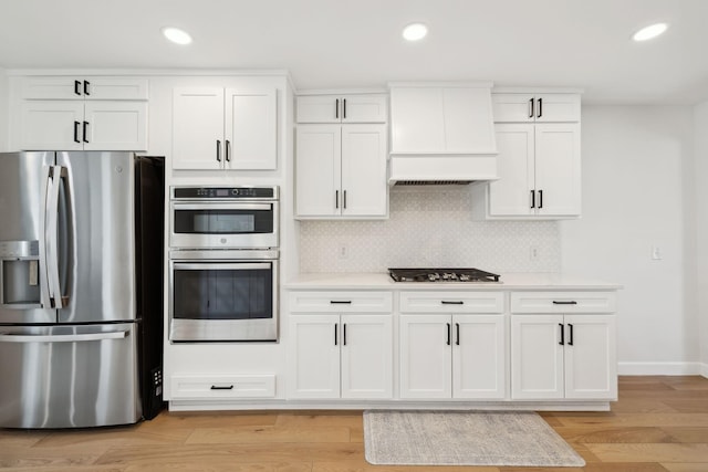 1048 Edgewater Cir, Gallatin, TN 37066 - kitchen with stainless steel appliances, recessed lighting, and custom range hood