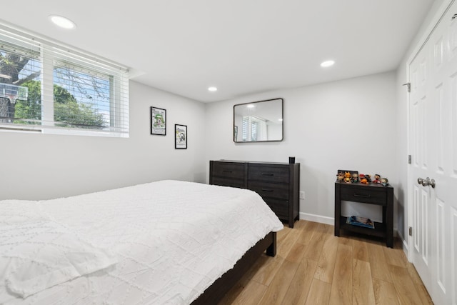 1048 Edgewater Cir, Gallatin, TN 37066 - bedroom with a closet, recessed lighting, light wood finished floors, and baseboards