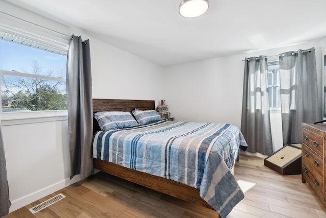 1048 Edgewater Cir, Gallatin, TN 37066 - bedroom with visible vents, baseboards, and light wood-style floors