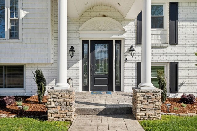 1048 Edgewater Cir, Gallatin, TN 37066 - entrance to property featuring a porch and brick siding
