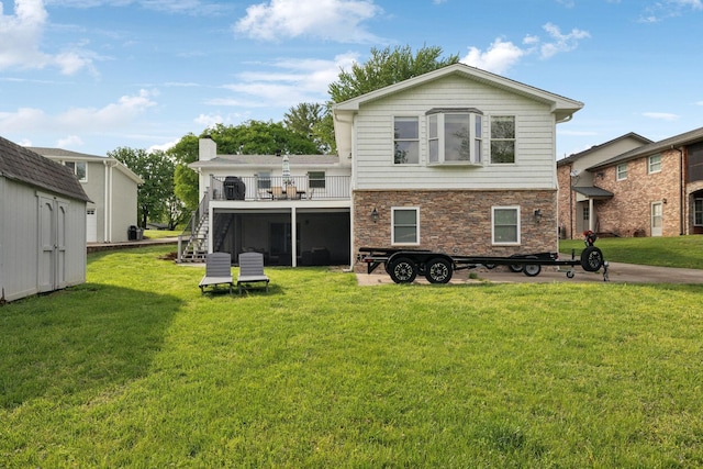 1048 Edgewater Cir, Gallatin, TN 37066 - rear view of house with an outbuilding, a storage shed, a lawn, stone siding, and stairs