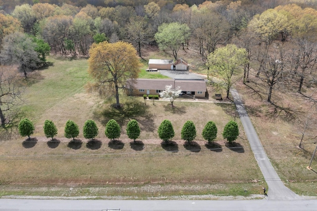 bird's eye view featuring a rural view and a wooded view