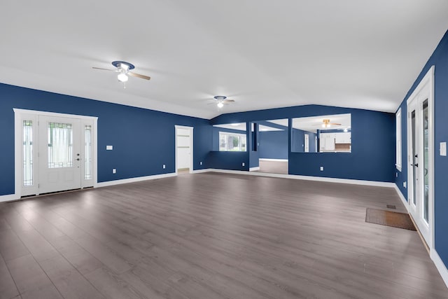 unfurnished living room with a healthy amount of sunlight, lofted ceiling, and ceiling fan