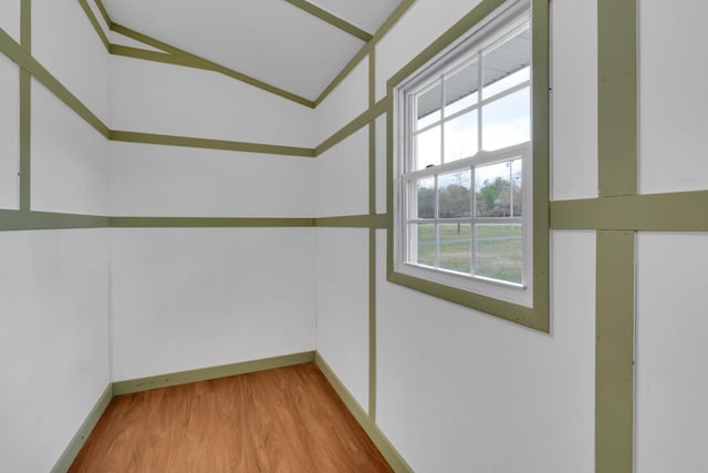interior space with wood finished floors and baseboards