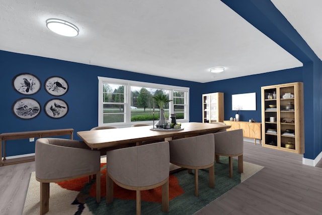 dining room with wood finished floors and baseboards