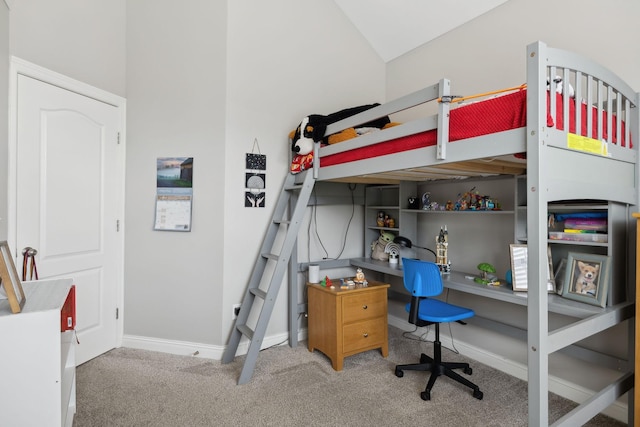 carpeted bedroom featuring baseboards and vaulted ceiling