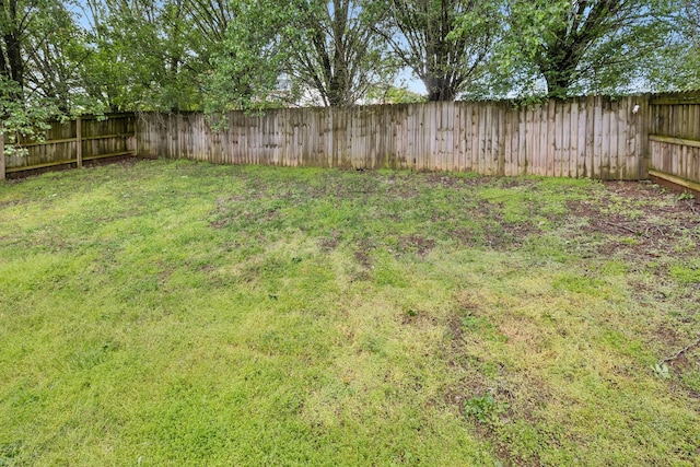 view of yard with a fenced backyard