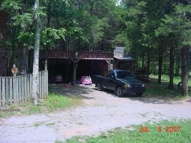 exterior space with fence and driveway