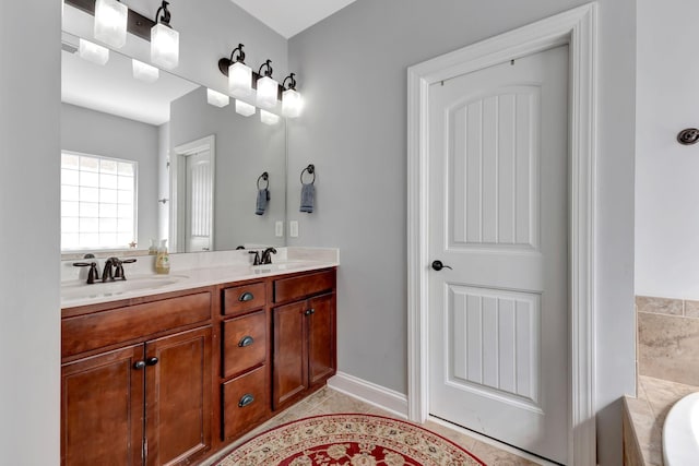 6029 Christmas Dr, Nolensville, TN 37135 - full bathroom with tile patterned floors, double vanity, a sink, and a bathtub