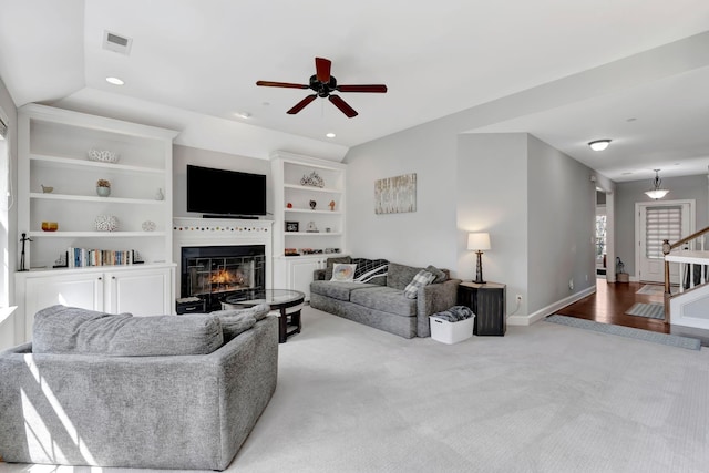 6029 Christmas Dr, Nolensville, TN 37135 - carpeted living area featuring visible vents, ceiling fan, recessed lighting, and a glass covered fireplace