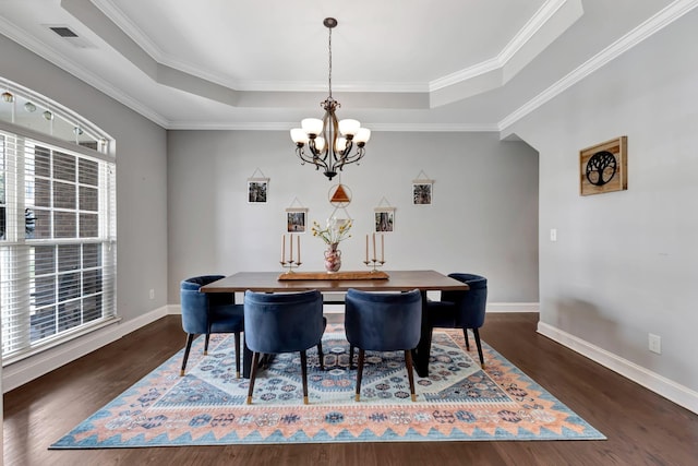 6029 Christmas Dr, Nolensville, TN 37135 - dining area featuring dark wood-style flooring, baseboards, a chandelier, visible vents, and a raised ceiling