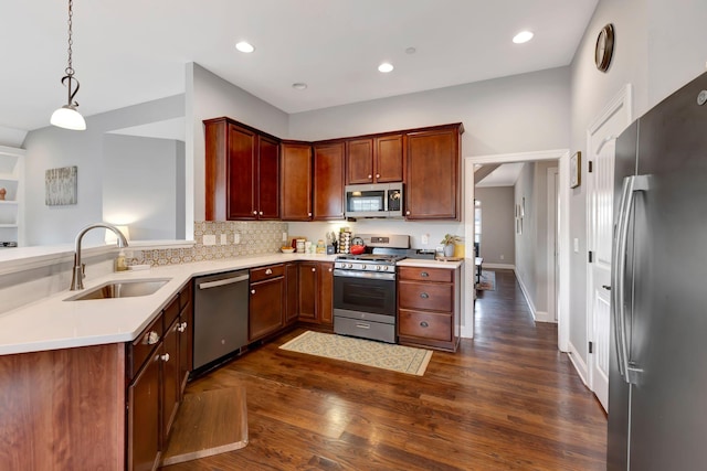 6029 Christmas Dr, Nolensville, TN 37135 - kitchen featuring dark wood-style floors, light countertops, a sink, and appliances with stainless steel finishes