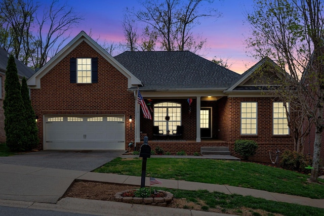6029 Christmas Dr, Nolensville, TN 37135 - view of front of home with covered porch, a garage, driveway, and brick siding