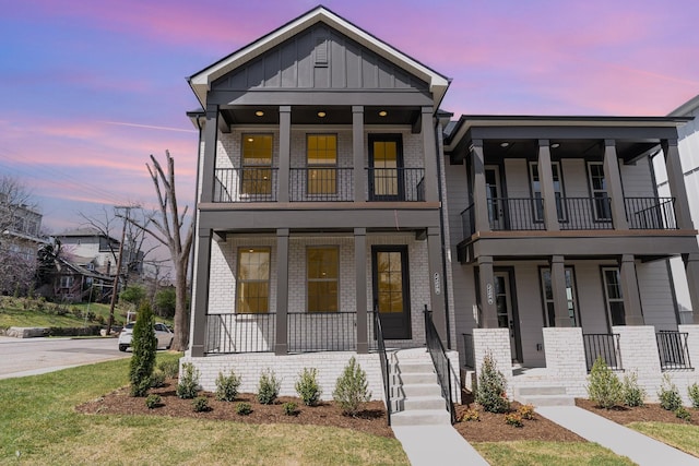 3106B Wellington Ave, Nashville, TN 37212 - view of front of home with a porch, board and batten siding, brick siding, a balcony, and a lawn