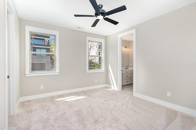 3106B Wellington Ave, Nashville, TN 37212 - unfurnished bedroom with connected bathroom, light colored carpet, a sink, baseboards, and visible vents