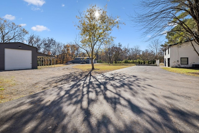 view of street with aphalt driveway