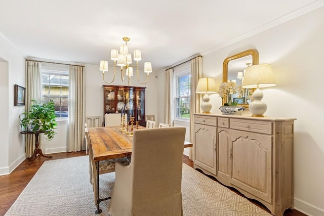 210 Cherokee Rd, Nashville, TN 37205 - dining room featuring crown molding, baseboards, a notable chandelier, and wood finished floors