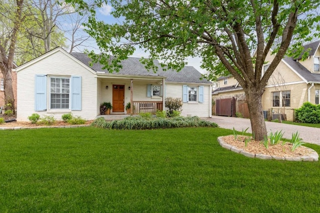 210 Cherokee Rd, Nashville, TN 37205 - ranch-style home featuring driveway, a front lawn, fence, a shingled roof, and covered porch