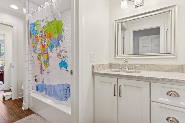 210 Cherokee Rd, Nashville, TN 37205 - bathroom with shower / bathtub combination with curtain, vanity, toilet, wood finished floors, and baseboards