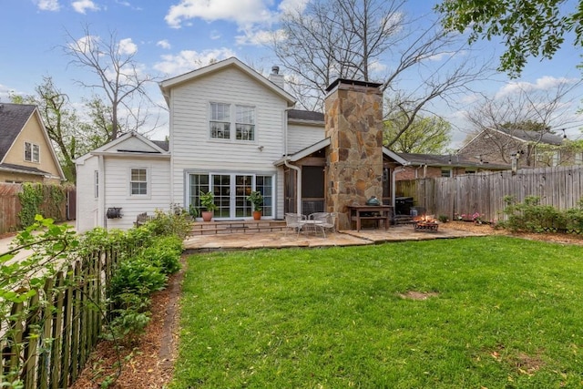210 Cherokee Rd, Nashville, TN 37205 - back of property with a yard, an outdoor fire pit, a fenced backyard, and a patio