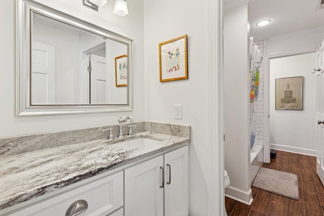 210 Cherokee Rd, Nashville, TN 37205 - bathroom featuring baseboards, ornamental molding, toilet, vanity, and wood finished floors