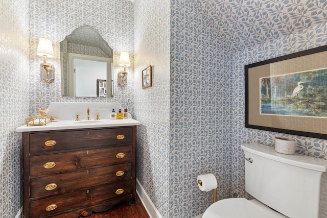 210 Cherokee Rd, Nashville, TN 37205 - bathroom with toilet, wallpapered walls, vanity, and wood finished floors