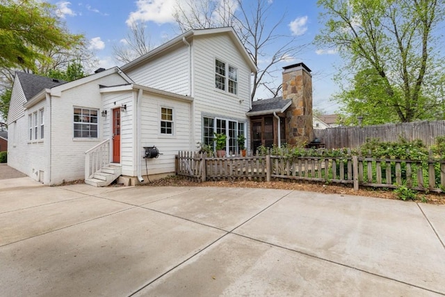 210 Cherokee Rd, Nashville, TN 37205 - back of house featuring entry steps, fence, and brick siding