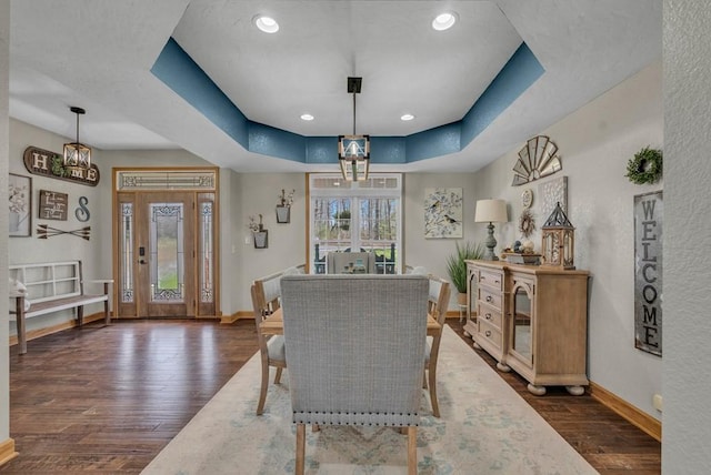 700 Falls Rd, Monterey, TN 38574 - dining room featuring a raised ceiling, an inviting chandelier, baseboards, and dark wood-style floors