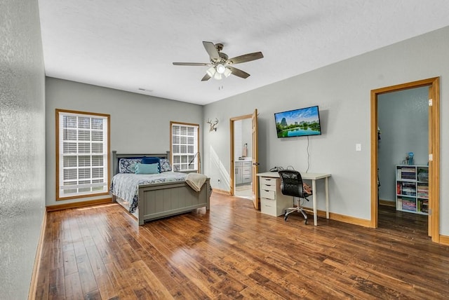 700 Falls Rd, Monterey, TN 38574 - bedroom featuring ensuite bath, baseboards, hardwood / wood-style floors, and ceiling fan