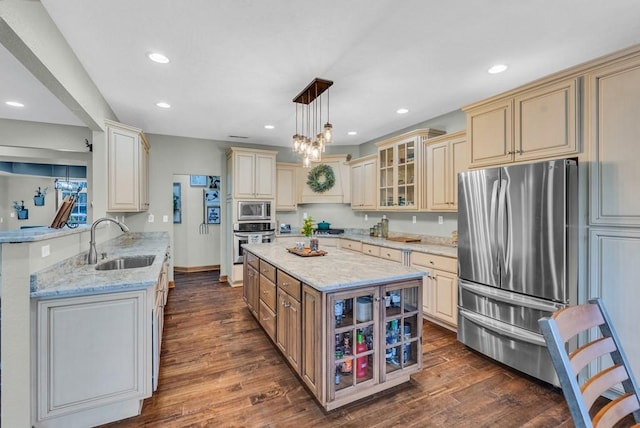 700 Falls Rd, Monterey, TN 38574 - kitchen featuring stainless steel appliances, a sink, cream cabinets, and dark wood finished floors
