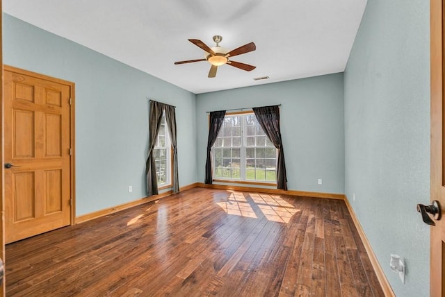 700 Falls Rd, Monterey, TN 38574 - spare room with visible vents, ceiling fan, hardwood / wood-style floors, and baseboards