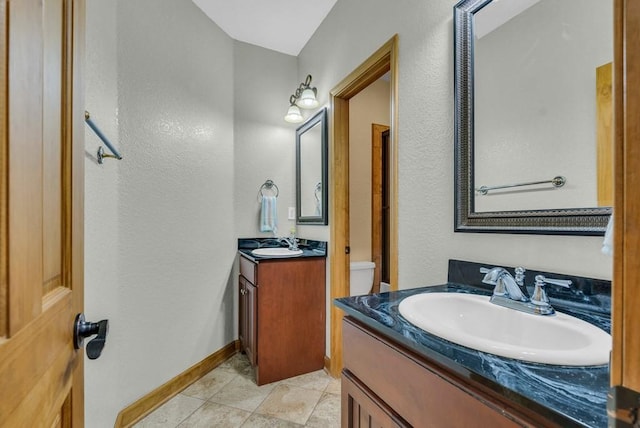 700 Falls Rd, Monterey, TN 38574 - bathroom featuring tile patterned floors, two vanities, a sink, and baseboards