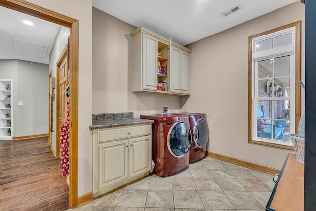 700 Falls Rd, Monterey, TN 38574 - clothes washing area with visible vents, baseboards, attic access, cabinet space, and washing machine and dryer