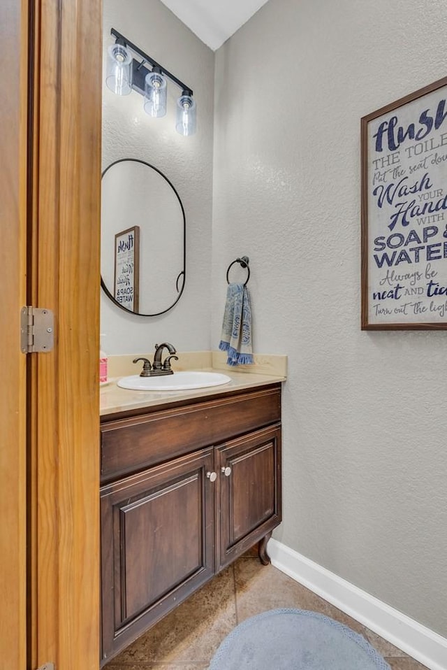 700 Falls Rd, Monterey, TN 38574 - bathroom with a textured wall, vanity, and baseboards