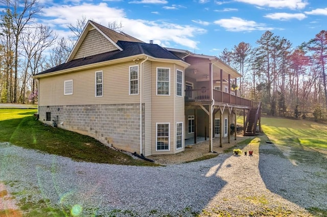 700 Falls Rd, Monterey, TN 38574 - view of side of property featuring a deck, a ceiling fan, a lawn, stairway, and a patio