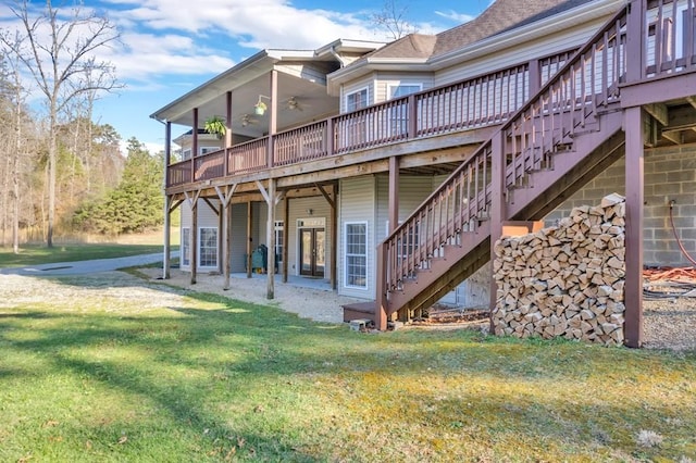 700 Falls Rd, Monterey, TN 38574 - rear view of property featuring a lawn, ceiling fan, a wooden deck, and stairs
