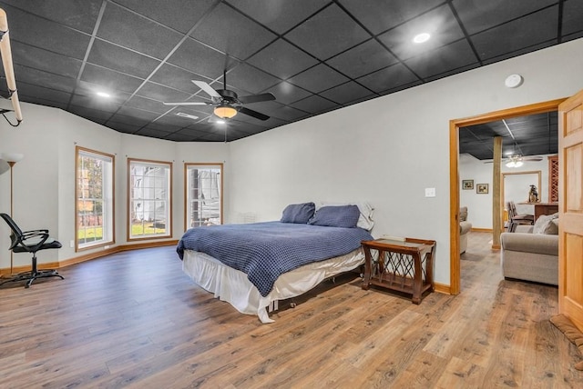 700 Falls Rd, Monterey, TN 38574 - bedroom with ceiling fan, a paneled ceiling, baseboards, and wood finished floors