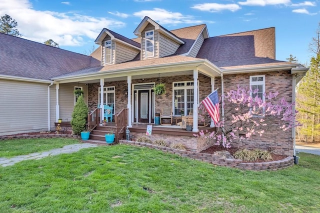 700 Falls Rd, Monterey, TN 38574 - view of front of house featuring a front yard, a porch, brick siding, and roof with shingles