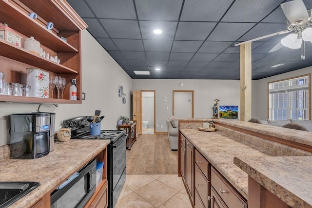 700 Falls Rd, Monterey, TN 38574 - kitchen featuring light tile patterned floors, electric range, open shelves, a ceiling fan, and a drop ceiling