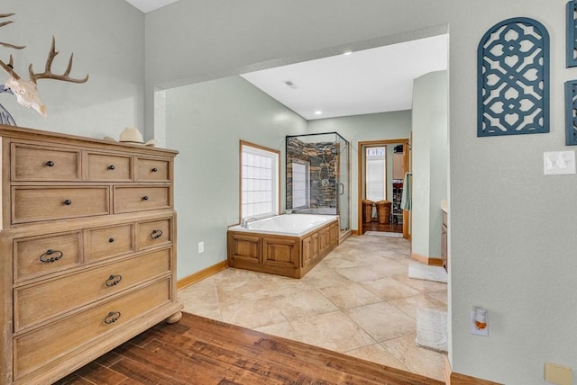 700 Falls Rd, Monterey, TN 38574 - bathroom with a shower stall, baseboards, a garden tub, and wood finished floors