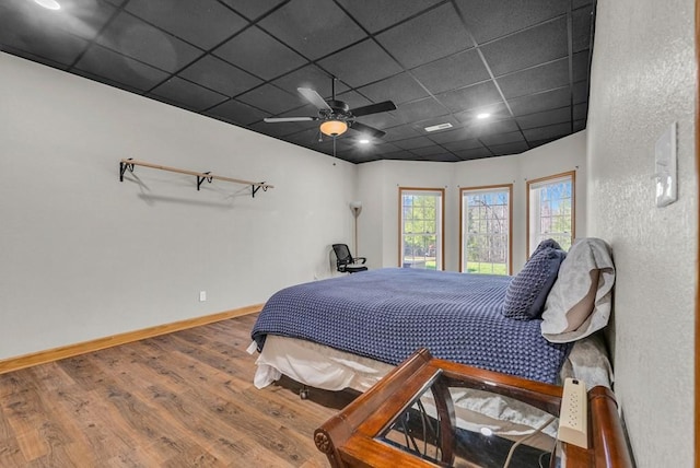 700 Falls Rd, Monterey, TN 38574 - bedroom featuring a paneled ceiling, baseboards, a ceiling fan, and wood finished floors