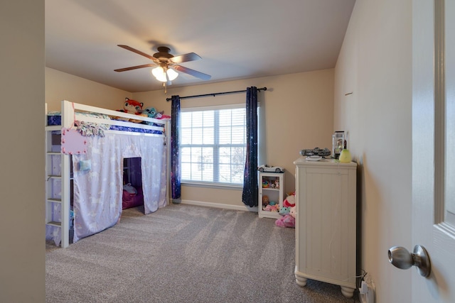 carpeted bedroom with baseboards and a ceiling fan