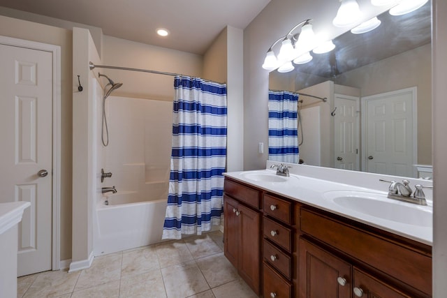 bathroom with tile patterned floors, double vanity, a sink, and shower / bathtub combination with curtain