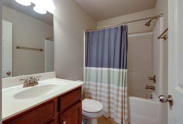 full bathroom featuring tile patterned floors, shower / bath combo with shower curtain, vanity, and toilet